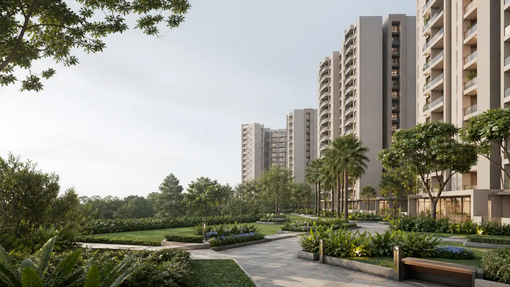 Contemporary light-coloured apartment buildings beside a landscaped pedestrian garden